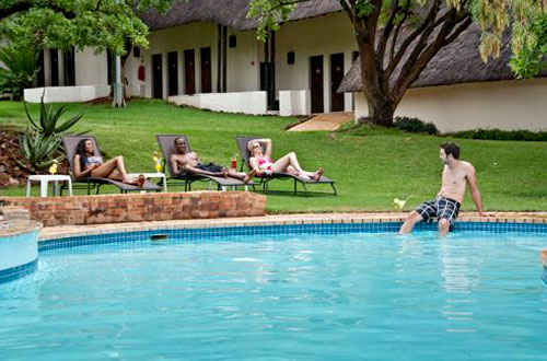 Relaxing next to the Swimming Pool at Kwa Maritane Bush Lodge - Safari Accommodation at Big Five Pilanesberg Game Reserve Relaxing Swimming Pool Kwa Maritane Bush Lodge Accommodation Bookings Pilanesberg Game Park Kwa Maritane Bush Lodge Big 5 Pilanesberg National Park South Africa